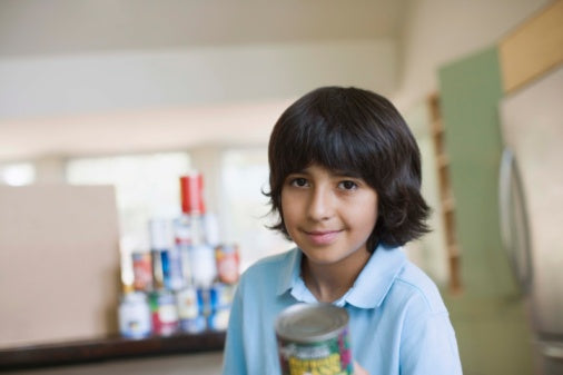 Boy holding canned food for food drive