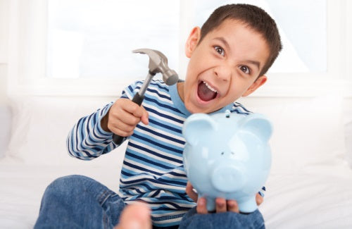 Boy smashing piggy bank with hammer chores money kids allowances