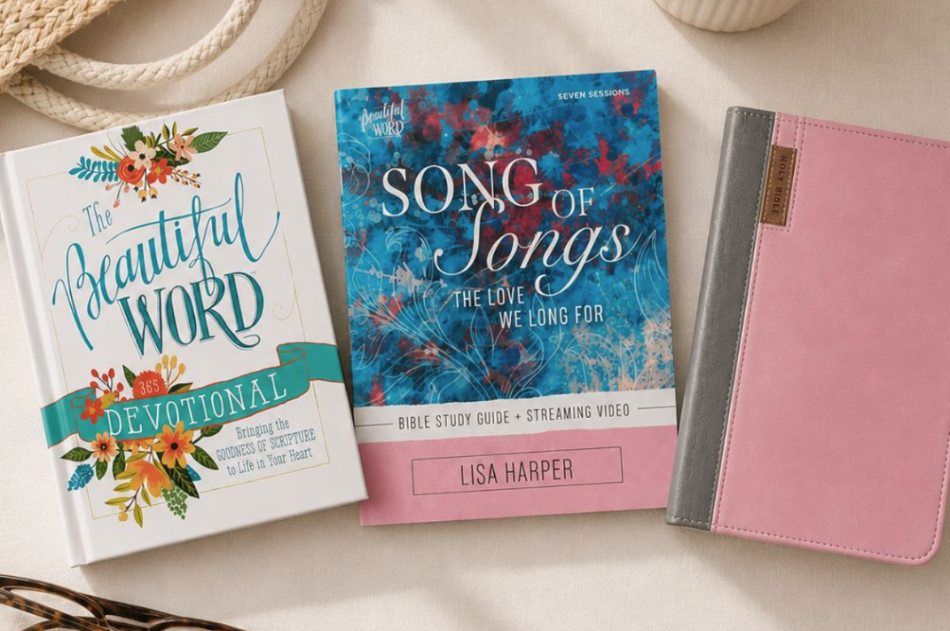 Three books on a light surface with decorative elements