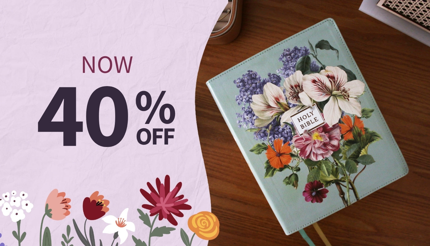 Floral notebook with a 40% off discount label on a wooden surface