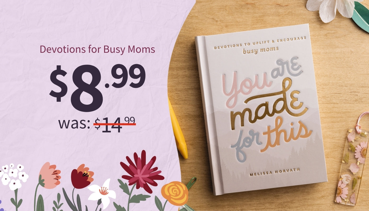 Book titled 'You Are Made for This' by Lucy Moms on a wooden surface with promotional text. Devotions for Busy Moms $8.99 was $14.99