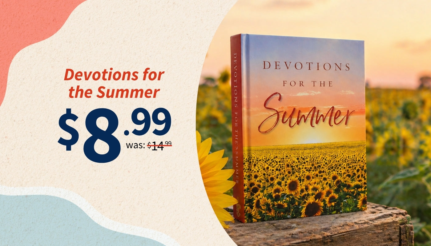 Book titled 'Devotions for the Summer' with a sunflower field cover, displayed on a wooden surface with a scenic background.