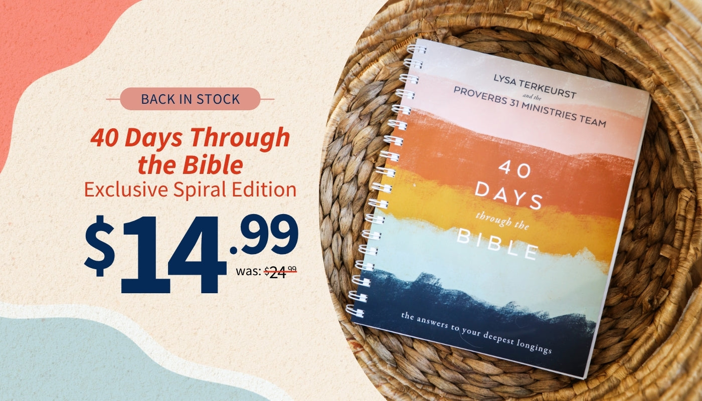 Spiral-bound book titled '40 Days Through the Bible' on a woven surface with promotional text.