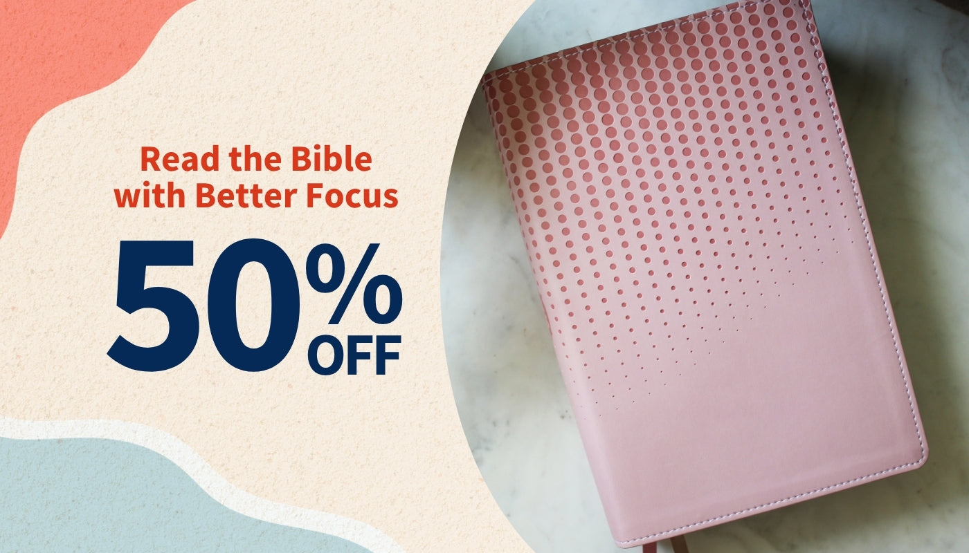 Pink bible with promotional text on a colorful background - NASB, Clear Focus Bible