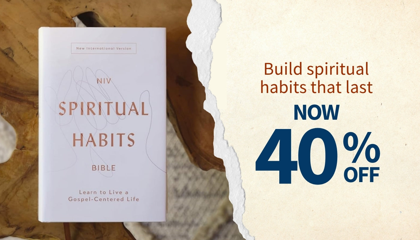 NIV Spiritual Habits Bible shown standing upright on a rustic wood surface, with a torn-paper style graphic and sale text on the right reading 'Build spiritual habits that last NOW 40% OFF'.
