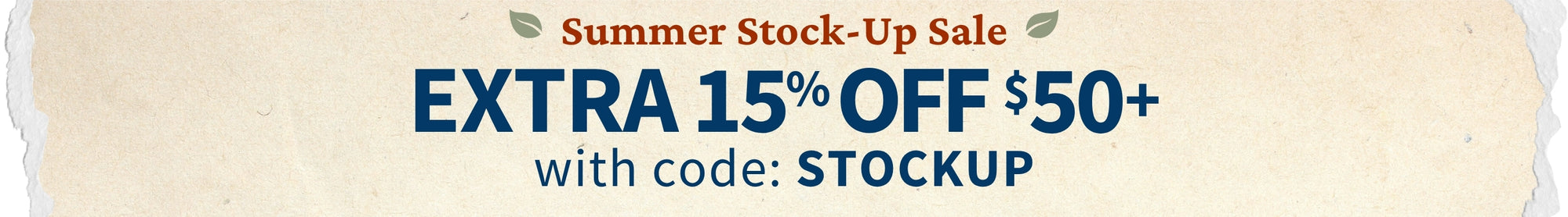 A promotional sale banner with a cream background and torn-paper edges, reading 'Summer Stock-Up Sale' and 'EXTRA 15% OFF $50+' with code 'with code: STOCKUP' in blue and brown text.