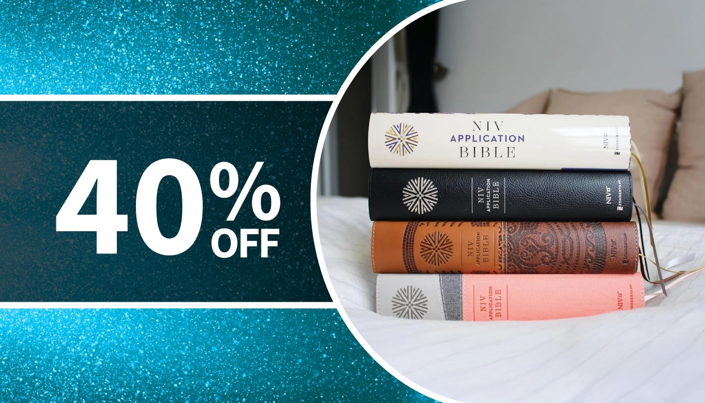 Stack of books on a bed with a '40% OFF' discount banner on a blue background