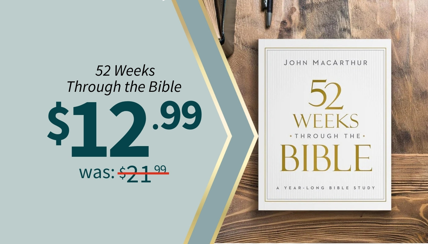 Book titled '52 Weeks Through the Bible' by John MacArthur on a wooden surface with promotional text. $12.99 was $21.99