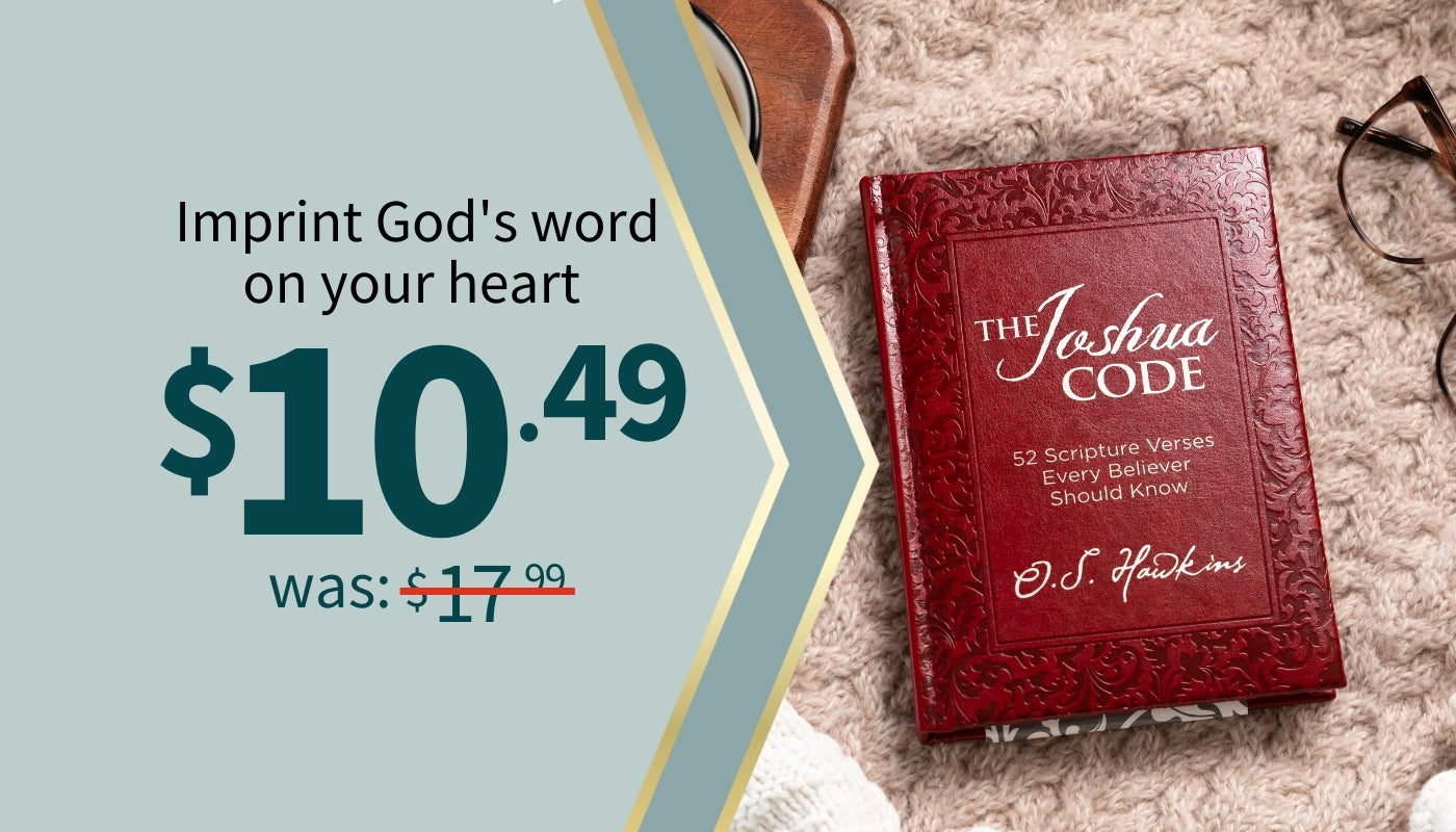 Red book titled 'The Joshua Code' with promotional text on a textured surface. $10.49 was $17.99